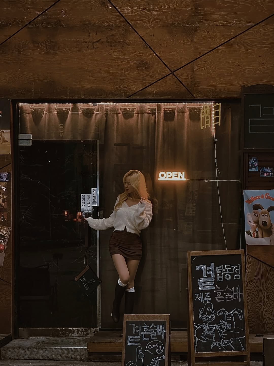 Photo shared by Kim Mumu on November 21, 2025 tagging @jeju.gyut_jeju.topdong. May be an image of miniskirt, poster and text.