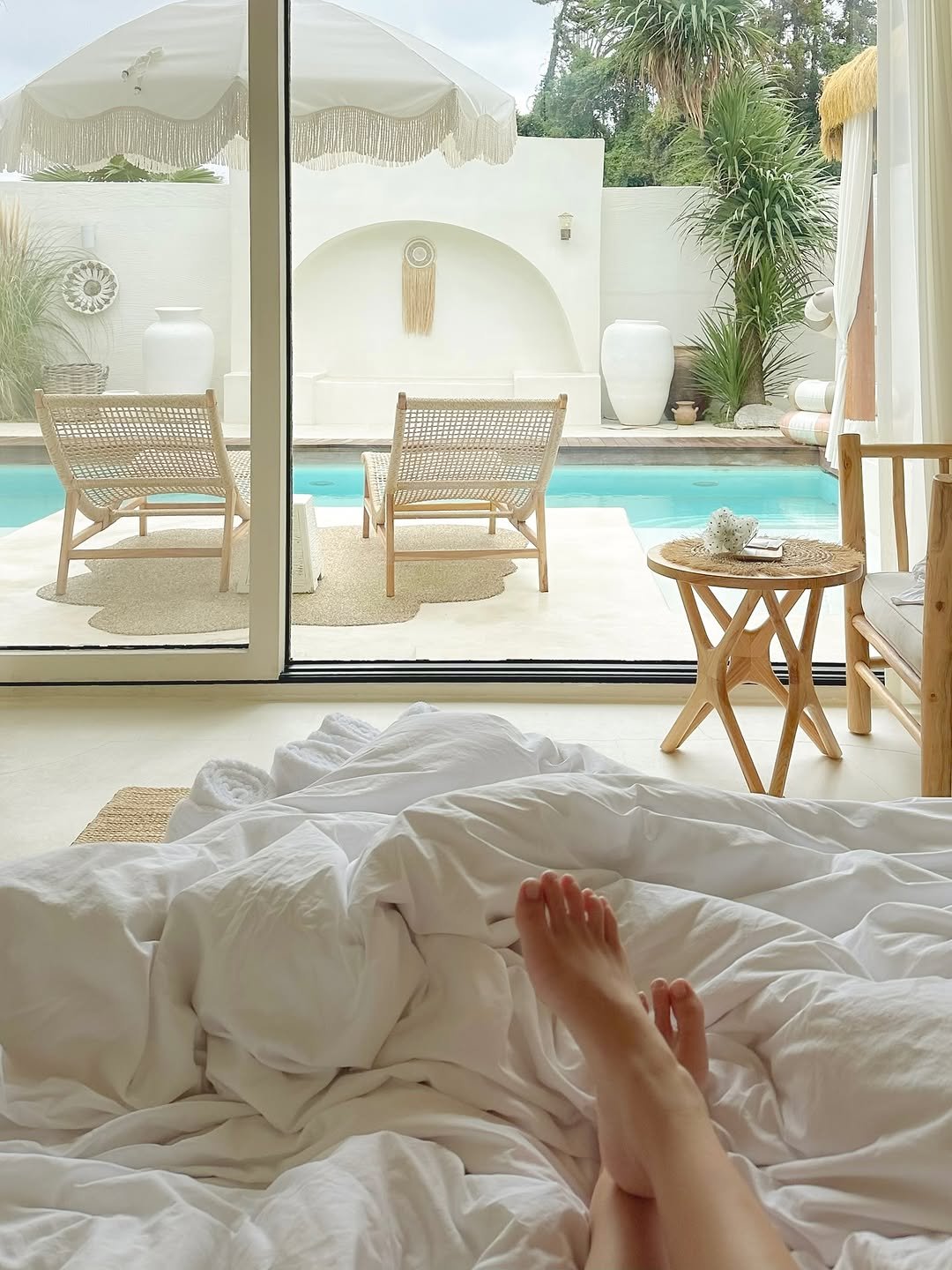 Photo shared by Kim Mumu on October 31, 2025 tagging @coconut_jeju. May be an image of mosquito net, towel, bed, pool, bedroom, cabana and text.