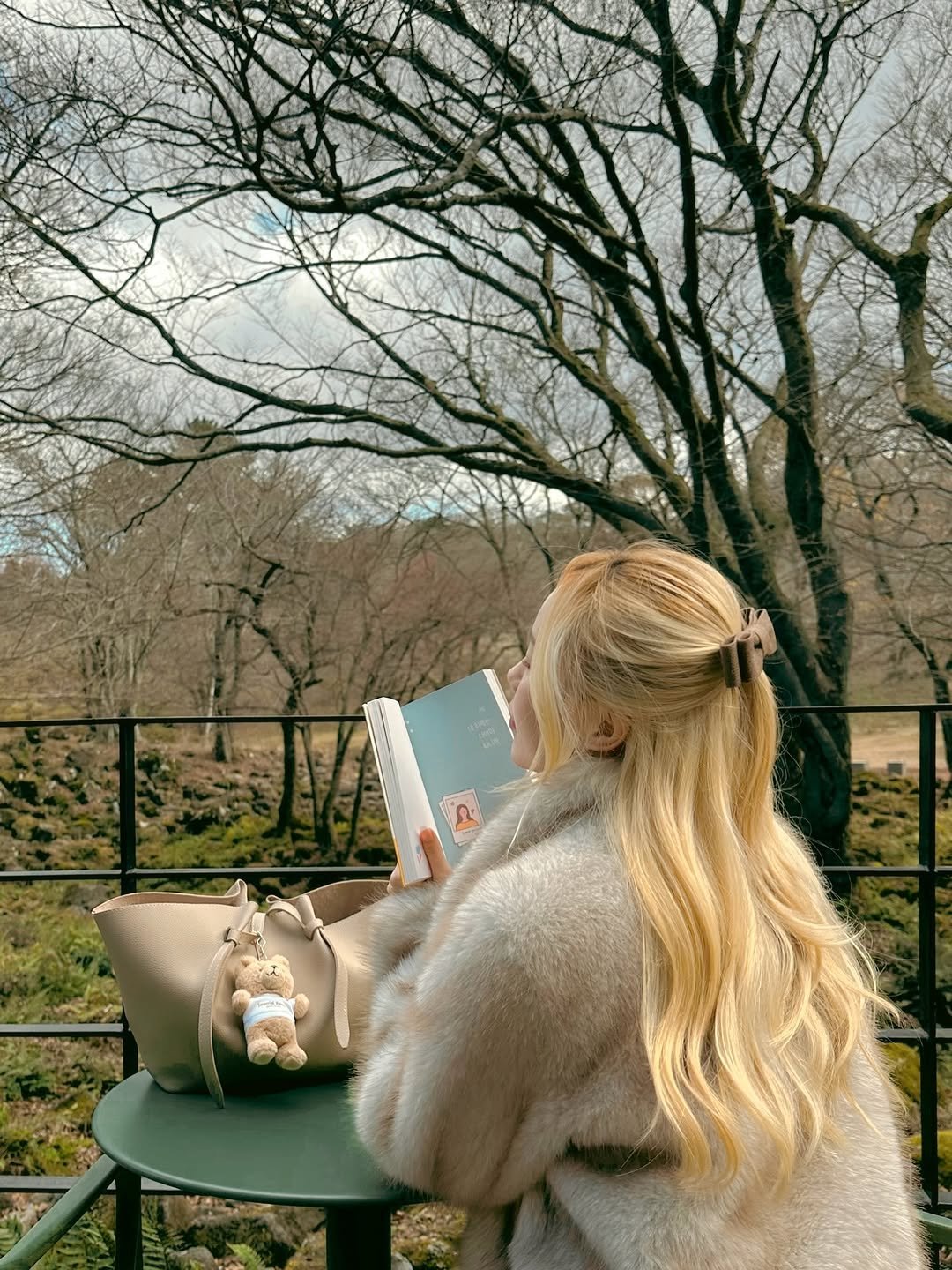 Photo by Kim Mumu on December 19, 2025. May be an image of book, park and text.