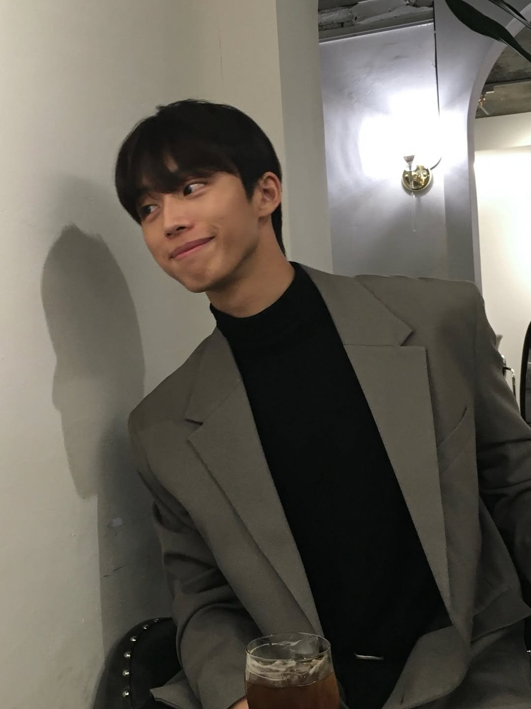 Photo by 조명식 on January 07, 2026. May be an image of blazer, turtleneck, bolo tie and text.
