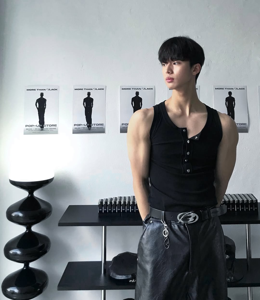 Photo shared by 조명식 on June 15, 2025 tagging @morethanblack_official. May be an image of one or more people, biceps, chess, top, sweatpants, belt and text.