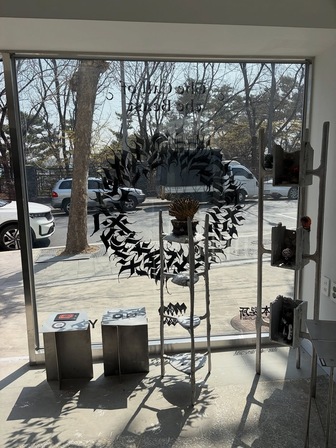 Photo shared by MUON on March 30, 2026 tagging @photokomori__, @robinceramicstudio, and @ytyfceramics. May be an image of display case, tree, window, door and text.