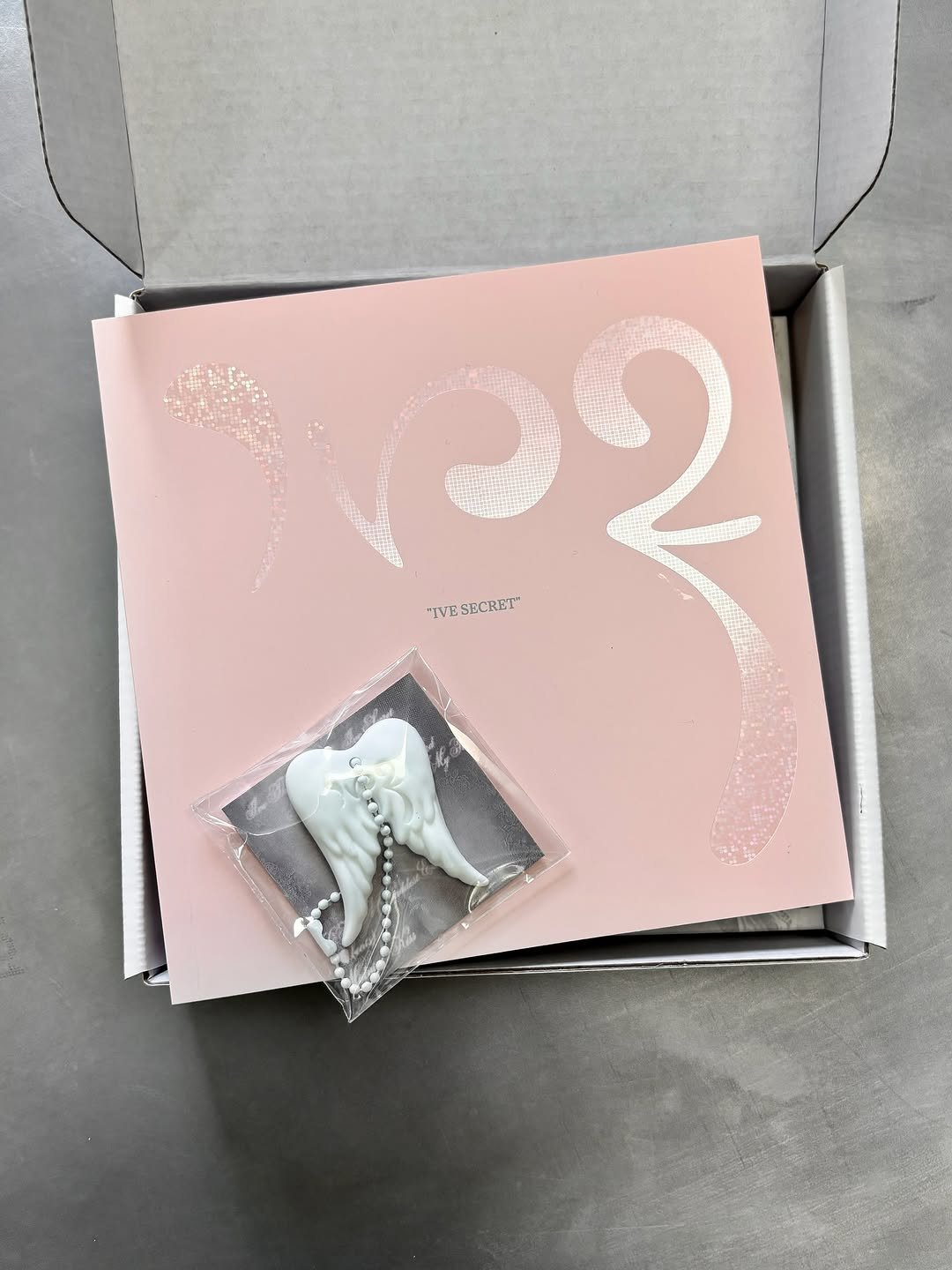 Photo shared by MUON on September 03, 2025 tagging @ivestarship. May be an image of one or more people, makeup, box, dental floss and text that says '02 "IVE "VESECRET" SECRET"'.