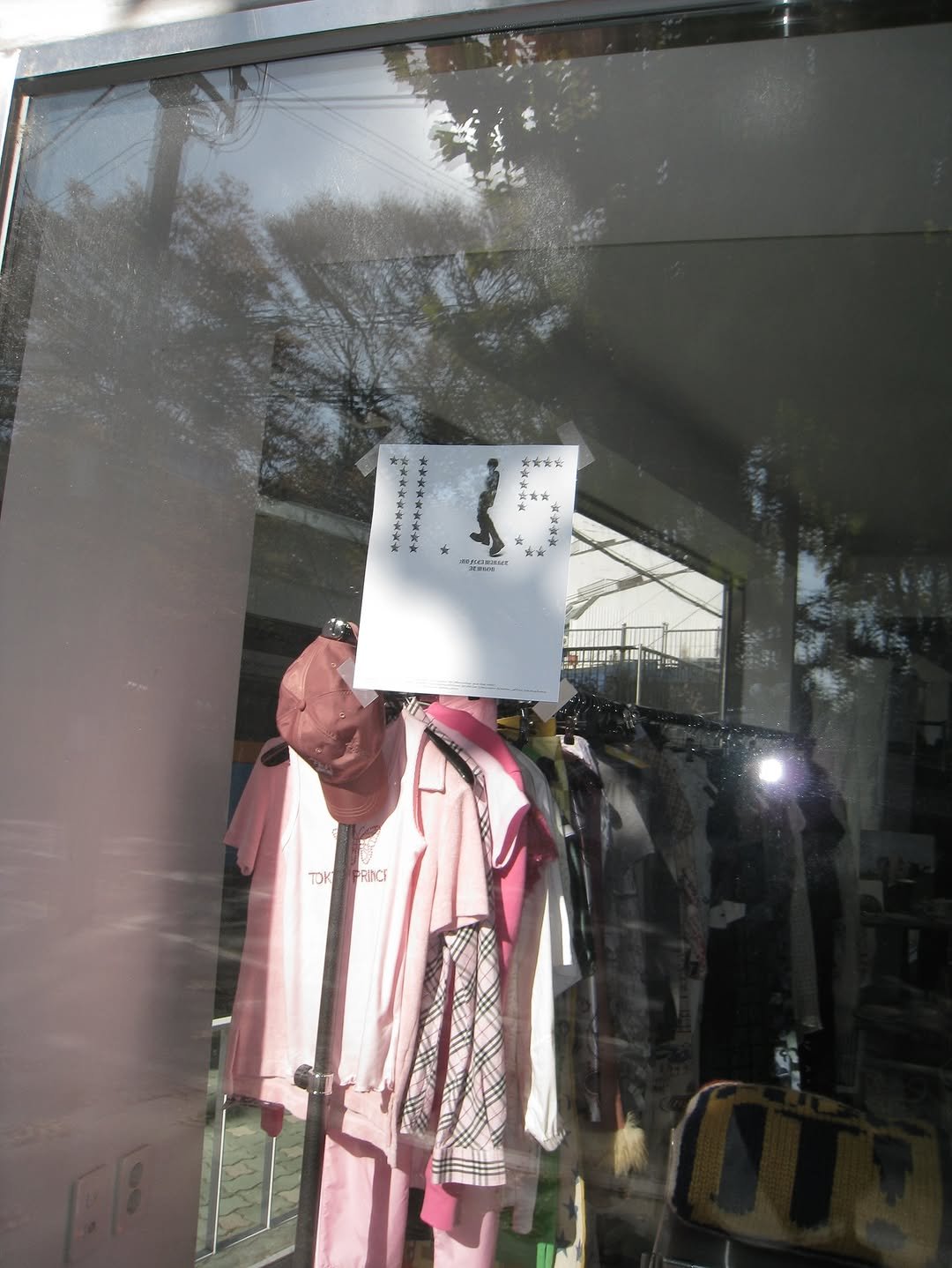 Photo shared by MUON on November 16, 2025 tagging @muon_office. May be an image of display case, clothes hanger, mannequin, window and text.