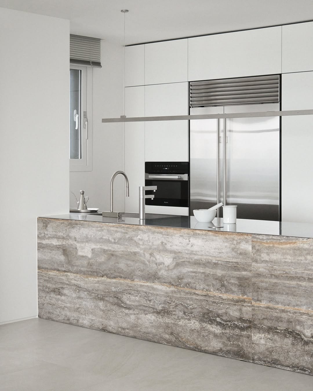 Photo by MMK_community on September 25, 2025. May be an image of range hood, sink, kitchen island, faucet, countertop, indoors, kitchen and text.