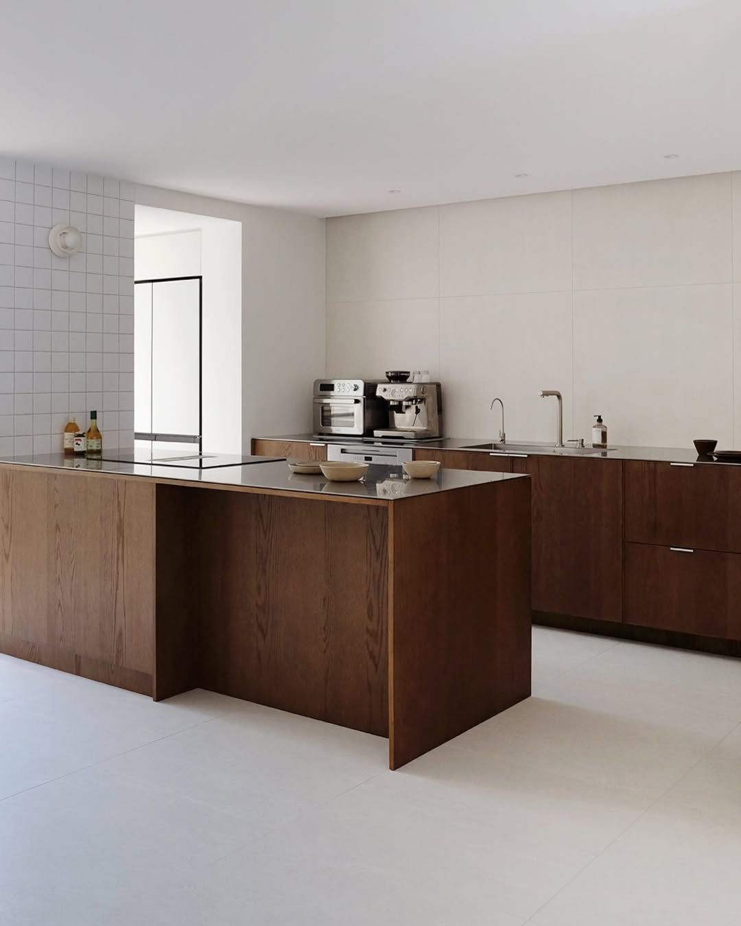 Photo by MMK_community on December 19, 2025. May be an image of kitchen island, sink, range hood, countertop, indoors, kitchen and text.