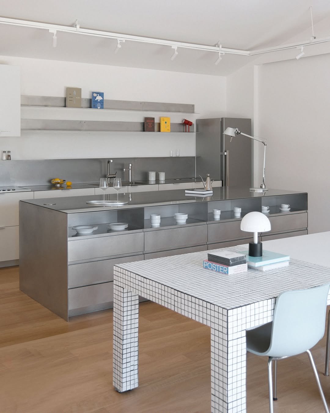 Photo by MMK_community on December 30, 2025. May be an image of kitchen island, table, kitchen table, dining table, countertop, indoors, kitchen and text.