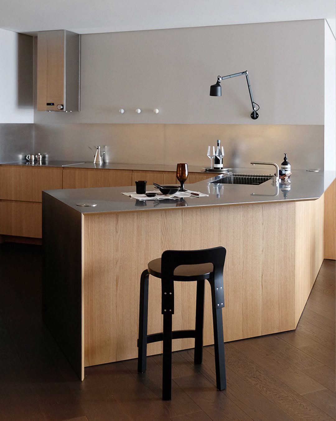 Photo by MMK_community on May 19, 2025. May be an image of kitchen island, range hood, sink, faucet, countertop, indoors, kitchen and text.