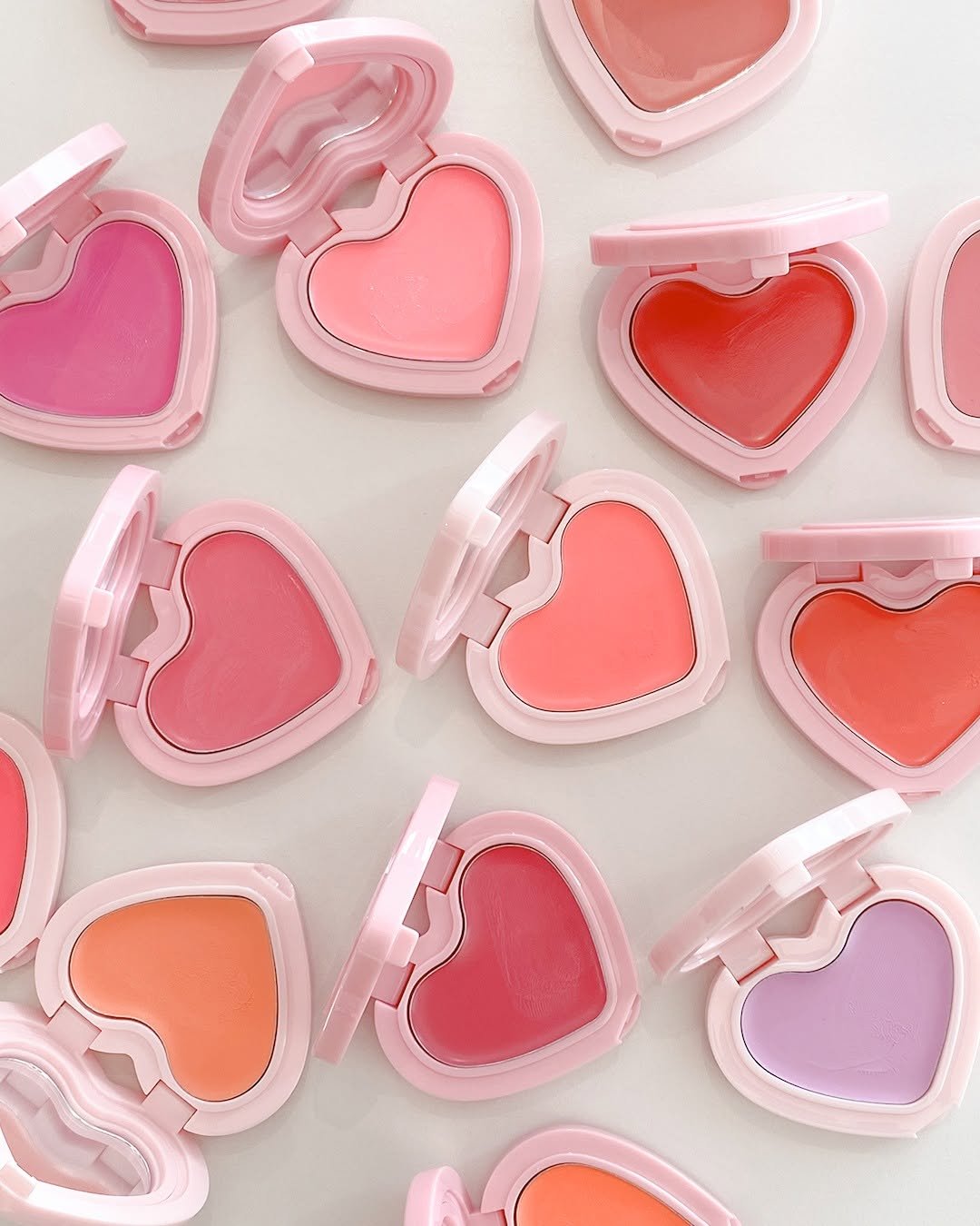 Photo by 무신사 뷰티 MUSINSA BEAUTY on August 20, 2025. May be an image of one or more people, makeup, lipstick, heart, cosmetics and text.