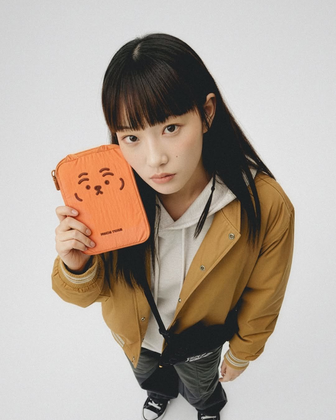 Photo shared by MUZIKTIGER 무직타이거 on September 25, 2025 tagging @muziktiger. May be an image of 1 person, bangs, duffle coat, parka and text.