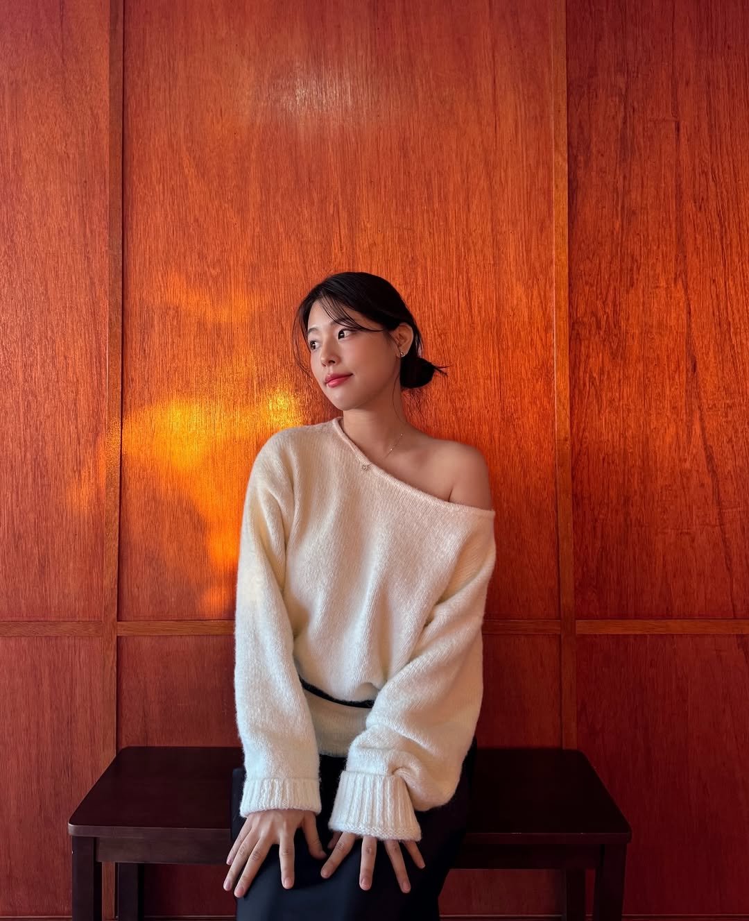 Photo by 내맘코 on December 26, 2025. May be an image of one or more people, hair, makeup, sweater, turtleneck and text.