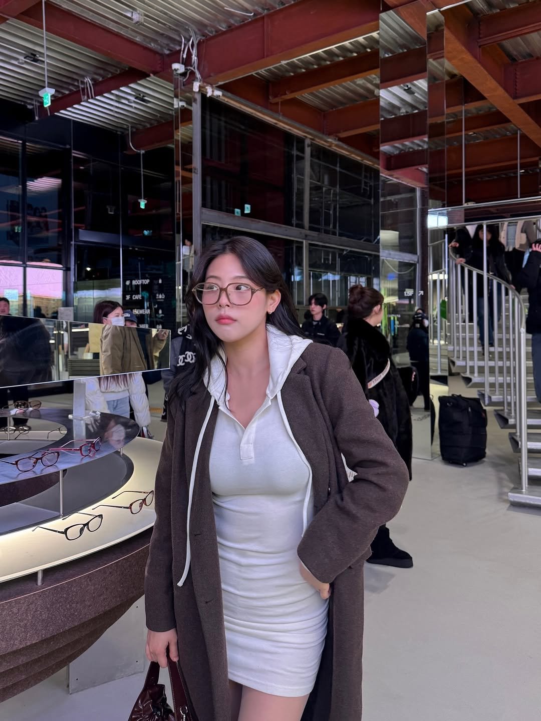 Photo by 내맘코 in 성수동 with @blueelephant.co. May be an image of overcoat, turtleneck and text.