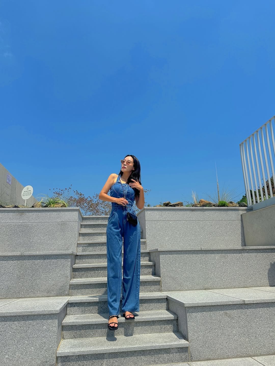 Photo by 유지어터 jiny :) on July 02, 2025. May be an image of 1 person, jumpsuit, outdoors and text.