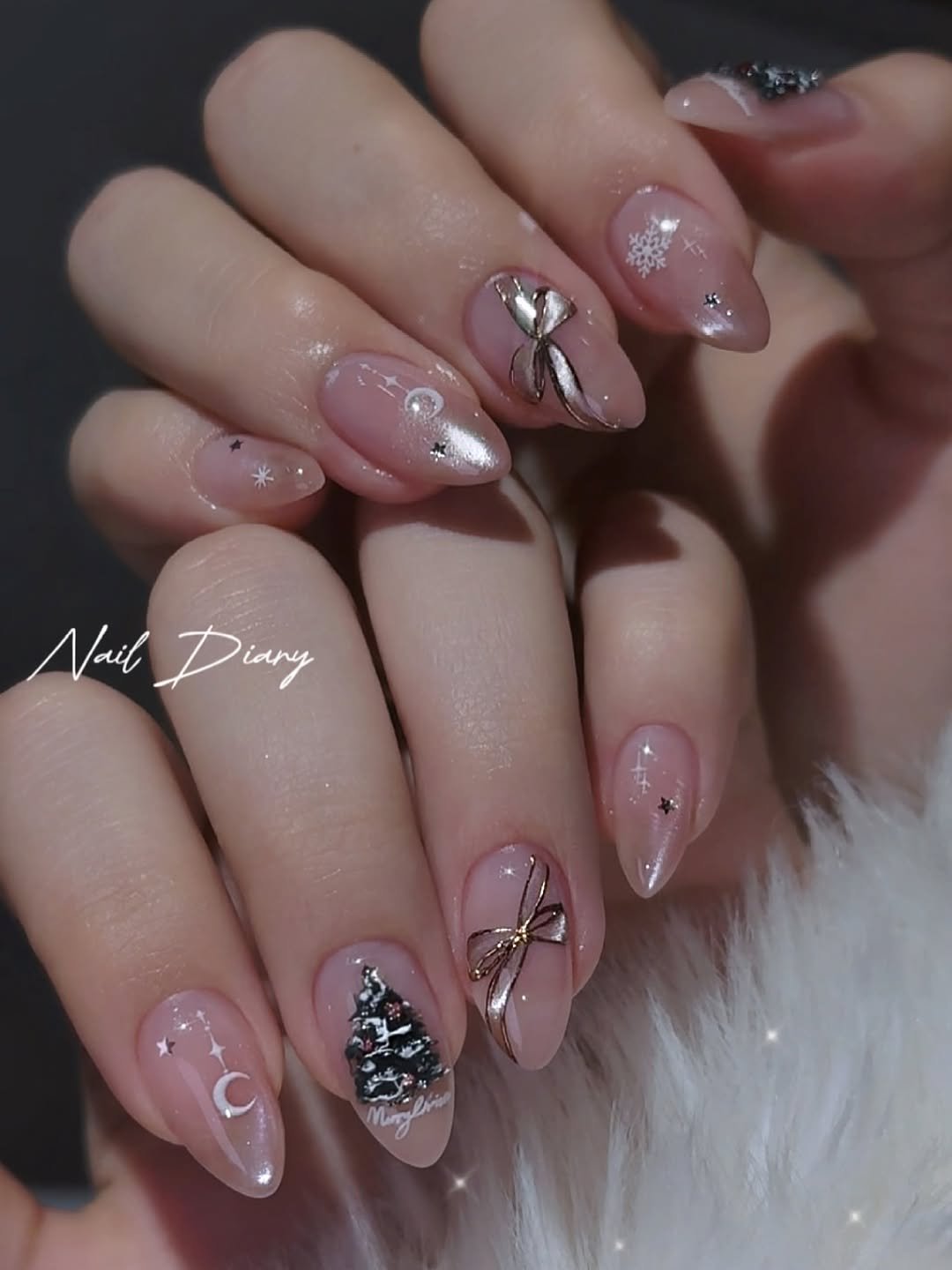 Photo by 네일다이어리 on November 13, 2025. May be an image of one or more people, fingernails and text.