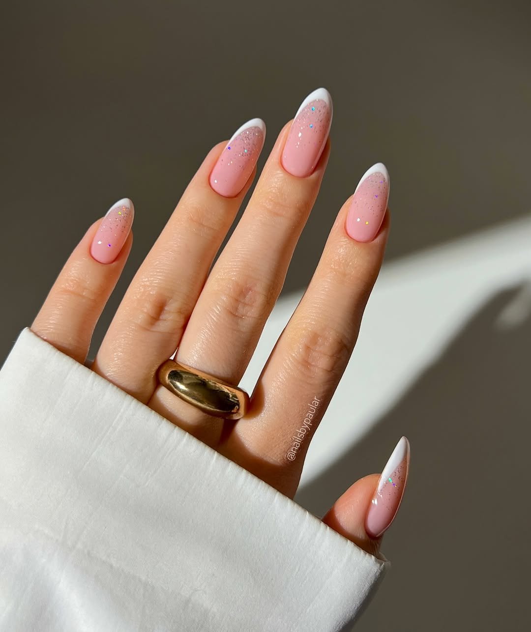 Photo shared by Paula 💅🏻🌙💗 on January 18, 2026 tagging @redcarpetmanicure. May be an image of one or more people, fingernails and text.