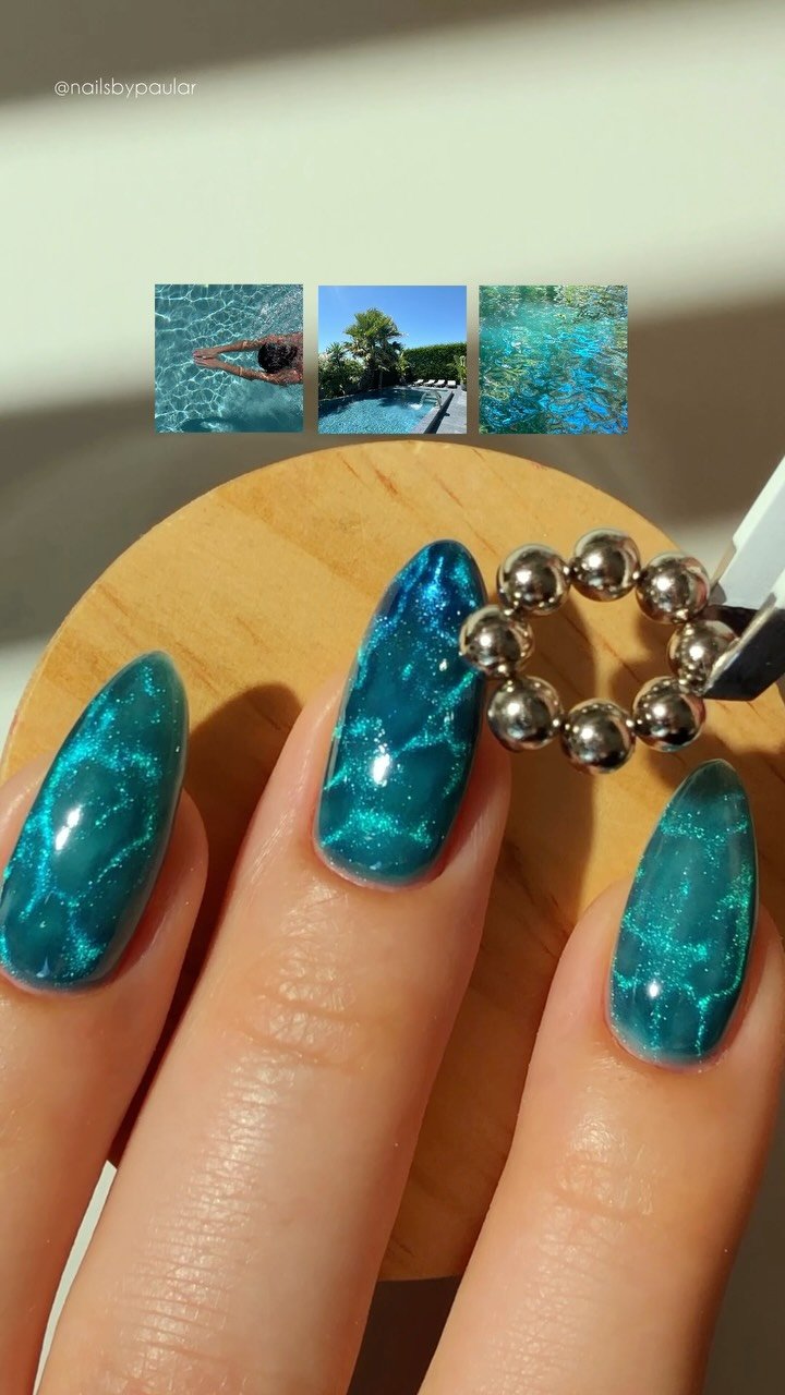 nailsbypaular 게시물 이미지: juicy pool nails! 🩵🌊💦✨
a vibrant blue cat eye...