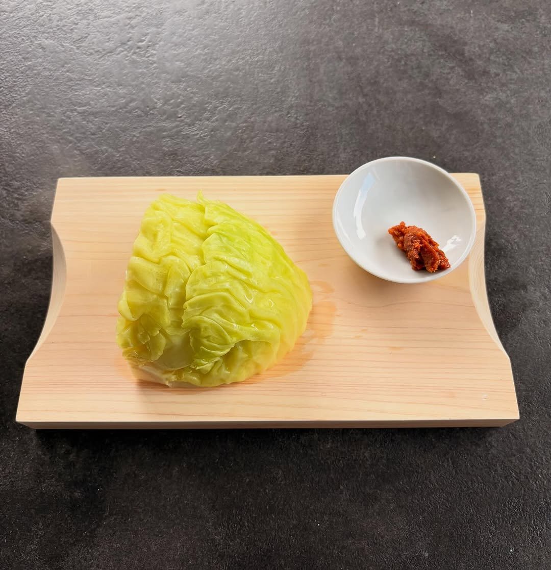 Photo by 남윤수 on March 30, 2026. May be an image of cabbage, condiment and text.