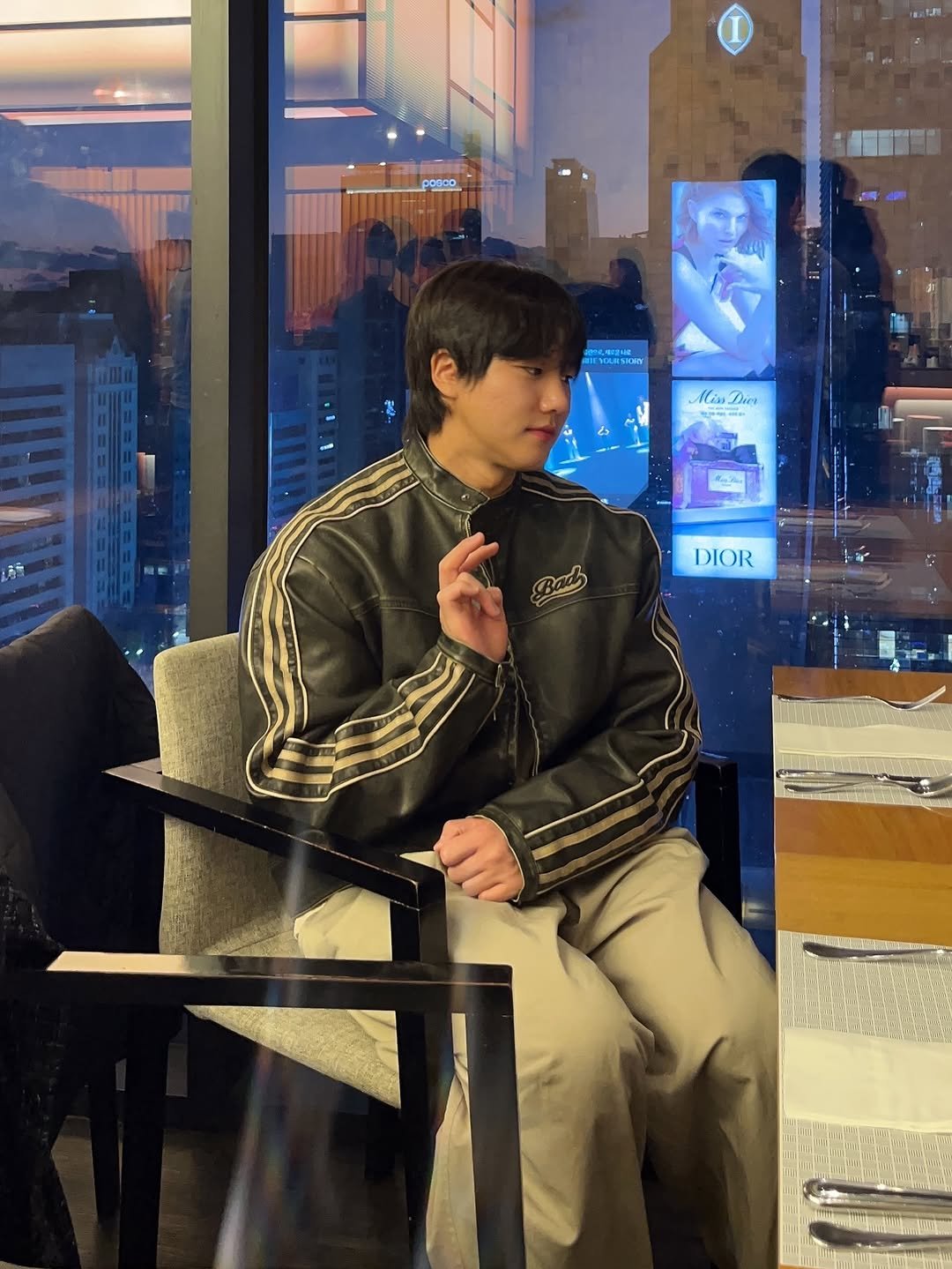 Photo by 난희 on November 06, 2025. May be an image of duffle coat, bolo tie, blazer and text.