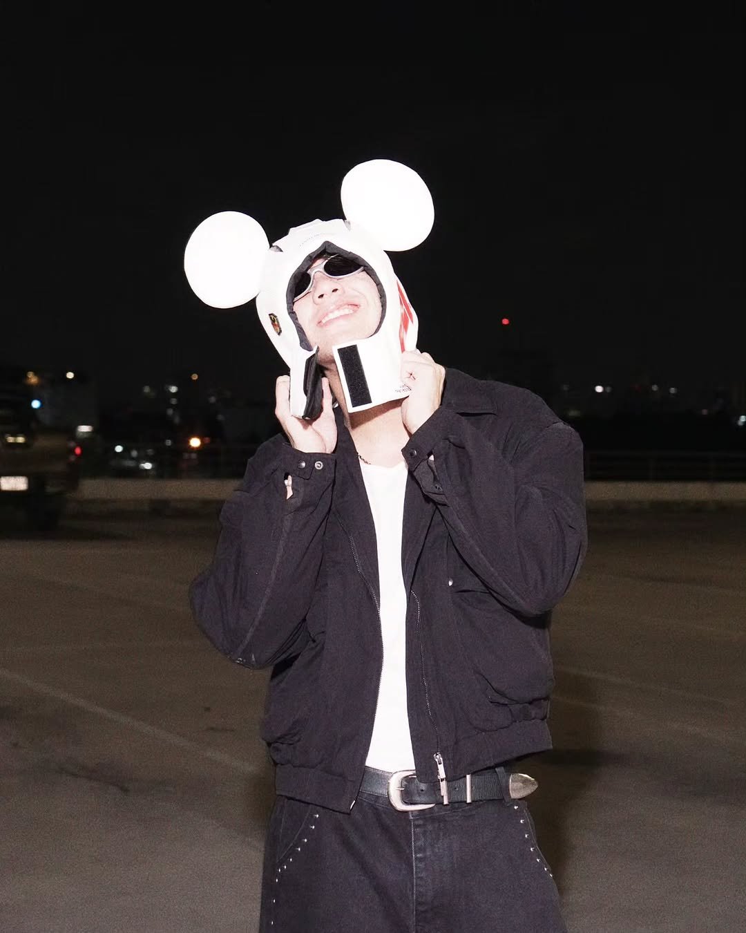 Photo by NANON on March 01, 2026. May be an image of hat, flight jacket, face mask and text.