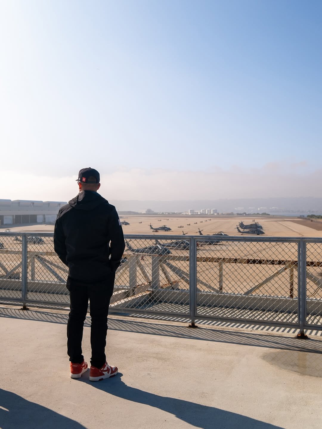 Photo shared by John Hunter Nemechek on December 15, 2025 tagging @nascar, @legacy.motorclub, and @nascarsandiego. May be an image of standing, beach, fog, ocean, horizon, coast and text.