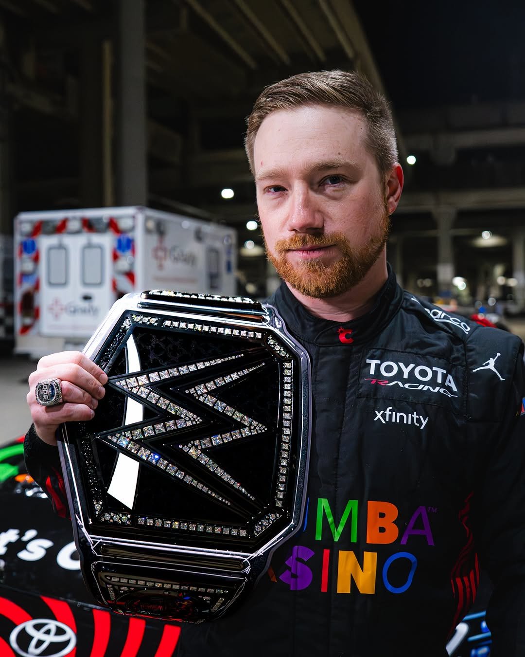 Photo shared by NASCAR on February 24, 2026 tagging @wwe, and @tyler_reddick. May be an image of racing vehicles and text.