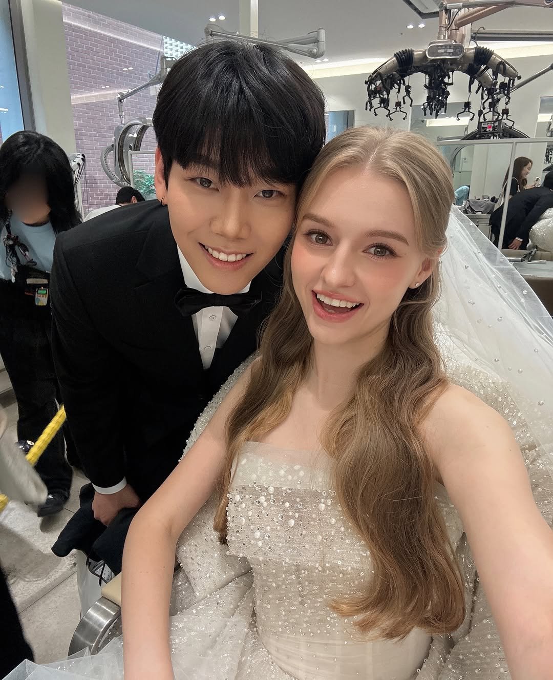Photo by Taesung & Nastya💍❤️ on July 06, 2025. May be an image of 2 people, hair, dress, gown, wedding and text.