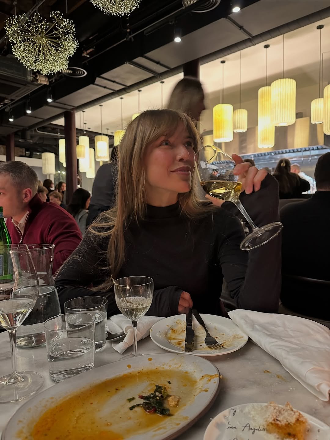 Photo by Natalia Rudin on December 22, 2025. May be an image of drink, escargot, wine glass and text.