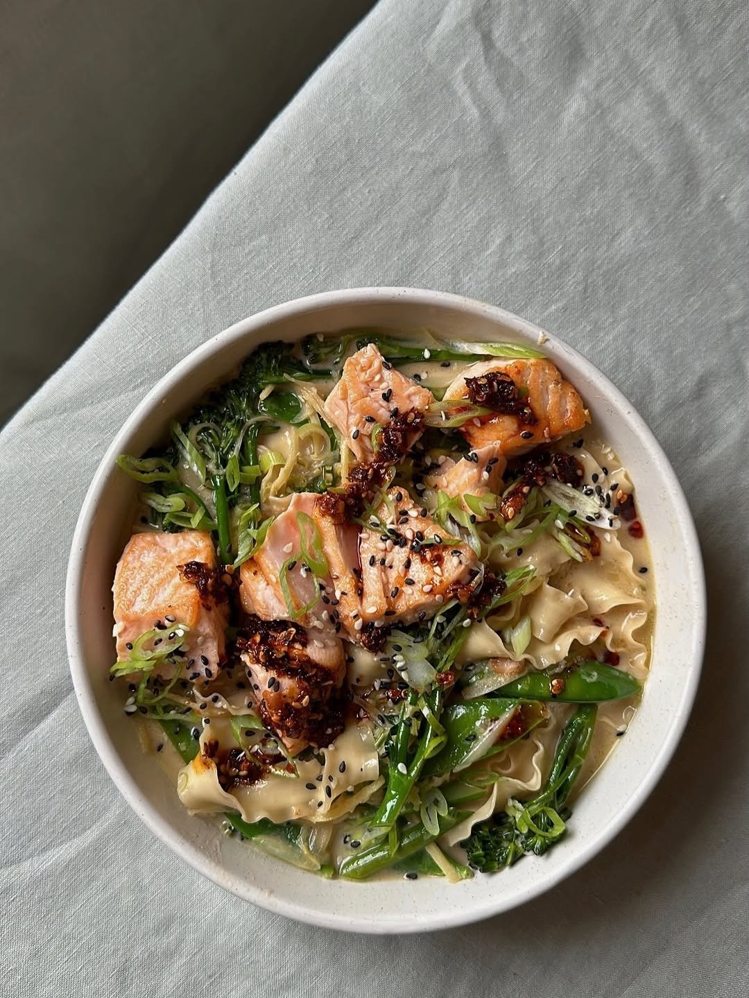 Photo by Natalia Rudin on January 01, 2026. May be an image of ramen, noodles, congee, tofu, chow mein, shiitake mushrooms and text.