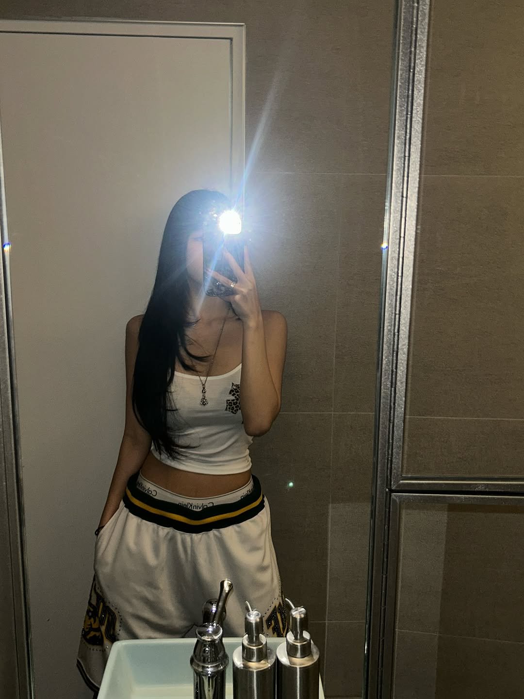 Photo by NATTY (( 나띠 )) on August 19, 2025. May be a selfie of 1 person, phone, sweatpants, shorts, mirror, skirt and text.