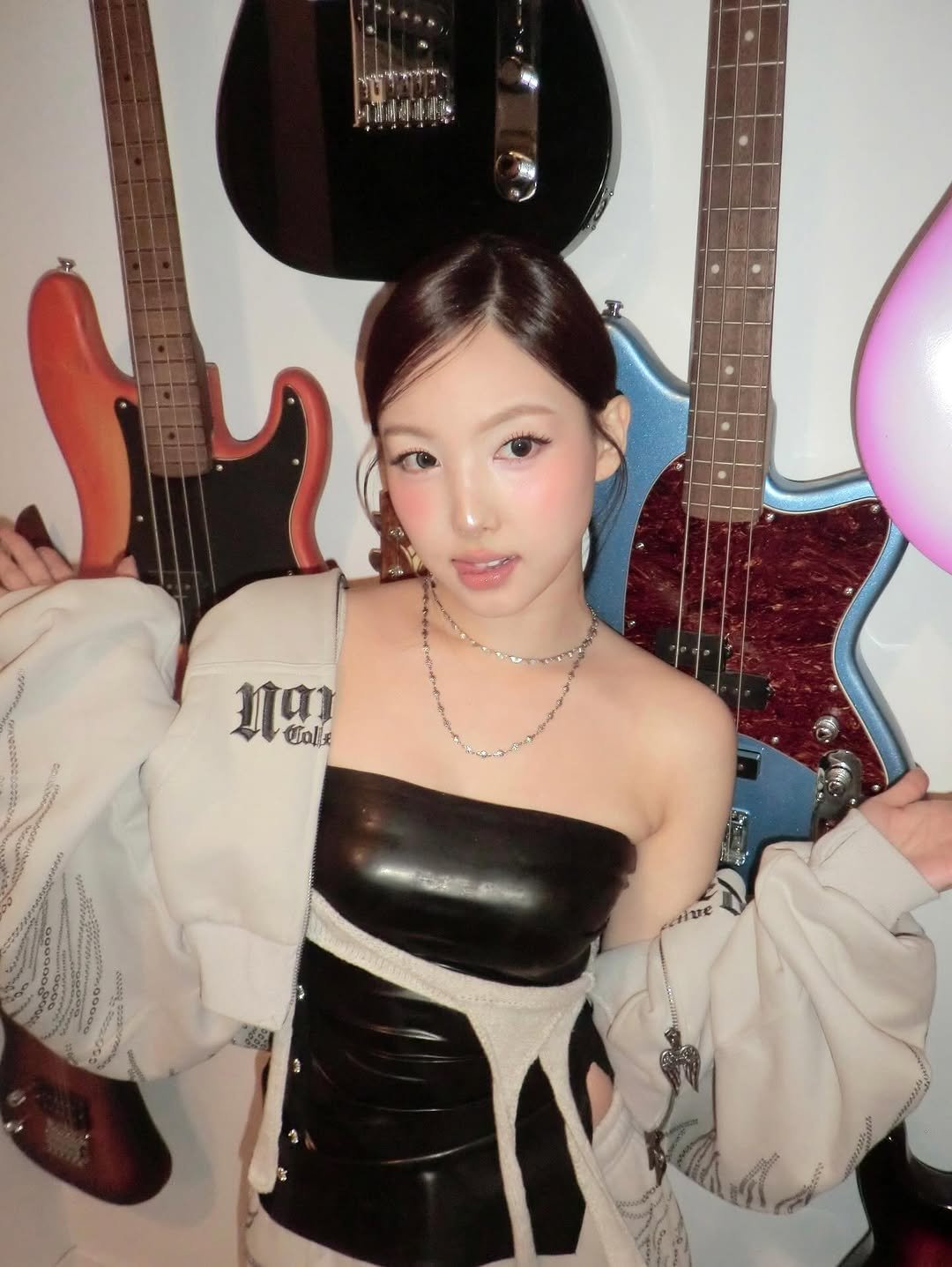 Photo by 나연 (NAYEON) on February 23, 2026. May be an image of one or more people, hair, bolo tie, top and text.