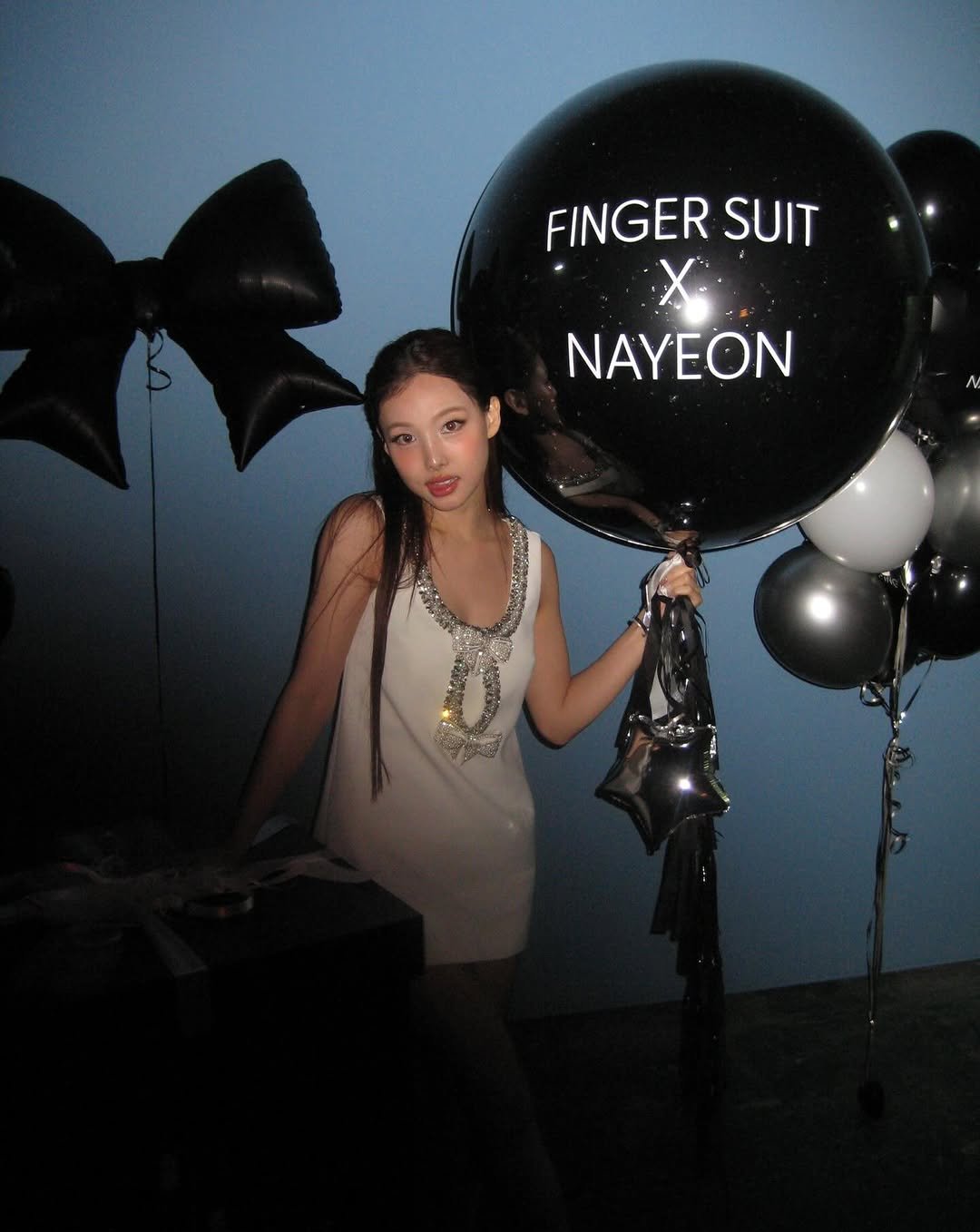 Photo shared by 나연 (NAYEON) on November 24, 2025 tagging @fingersuit_jp, and @fingersuit_kr.