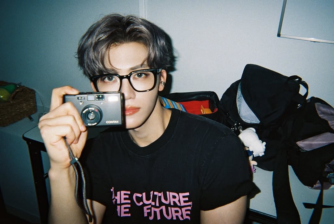Photo shared by NCT Official Instagram on August 12, 2025 tagging @na.jaemin0813. May be an image of 1 person, polaroid, bolo tie and text that says 'CONTAD 情 CUTURE CUTURE FITURE'.