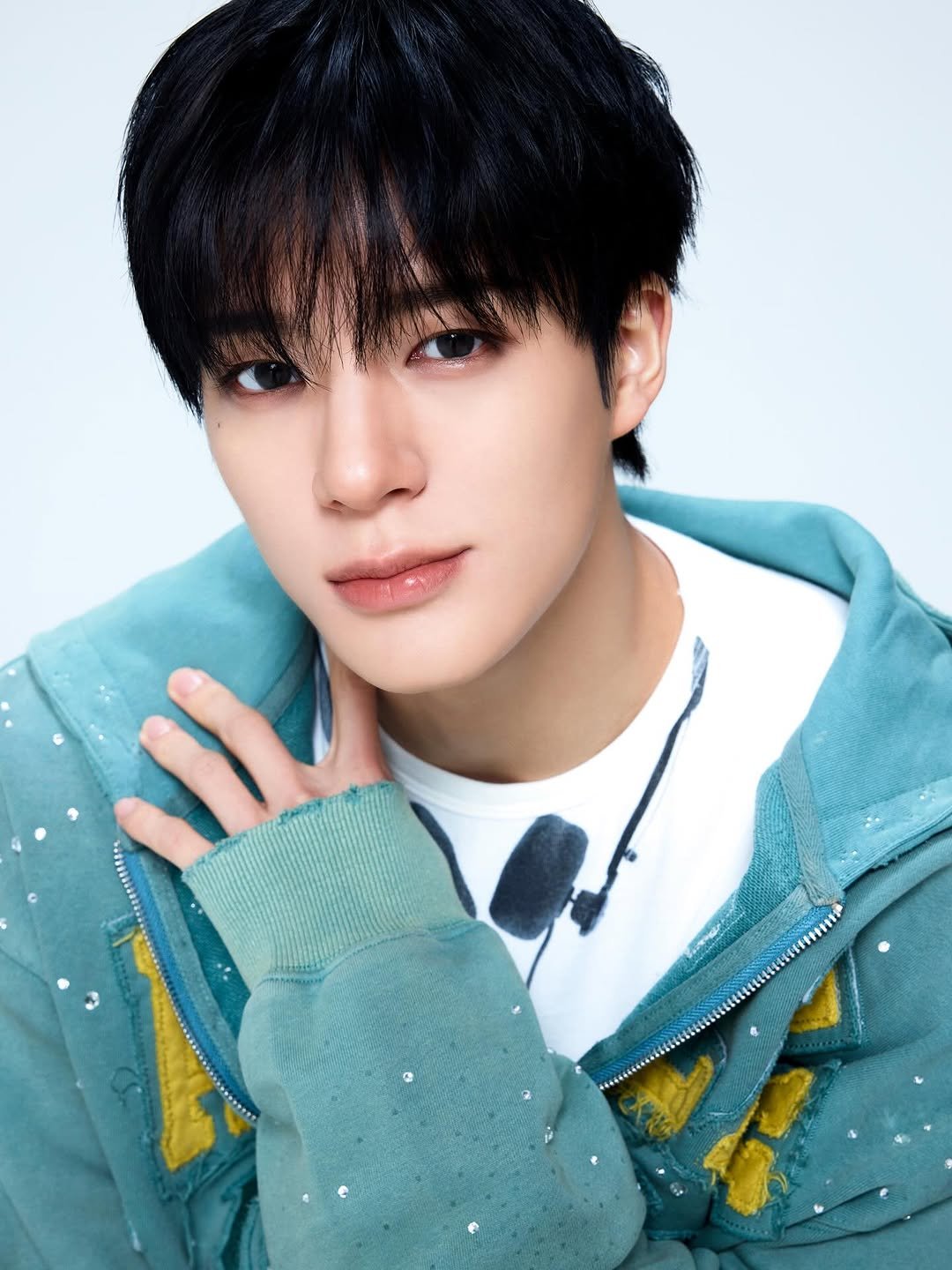 Photo shared by NCT Official Instagram on April 27, 2026 tagging @leejen_o_423. May be an image of one or more people, bangs, bolo tie and text.