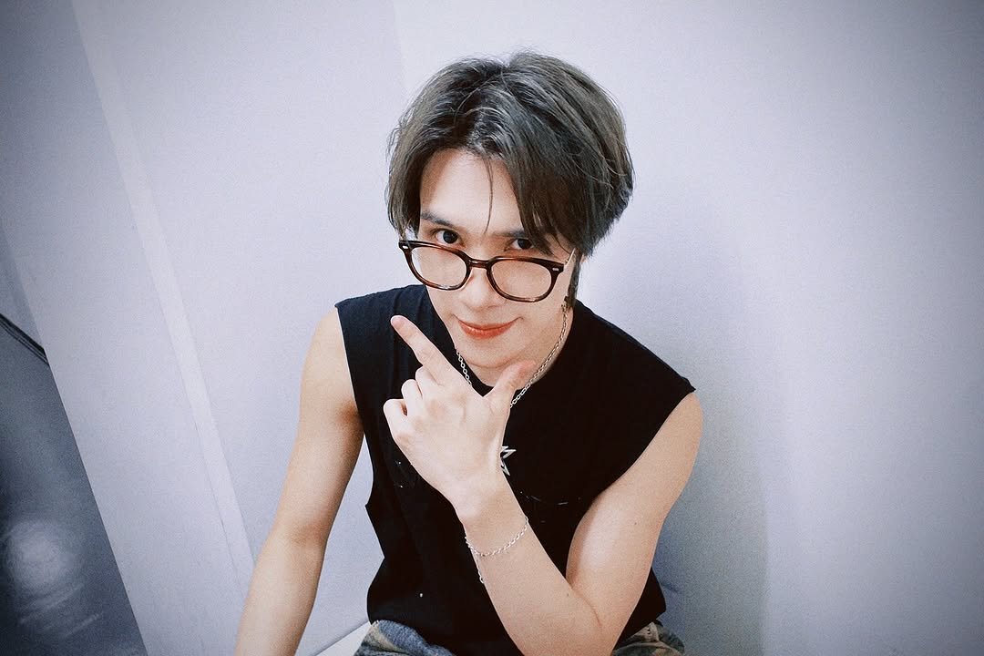 Photo shared by NCT Official Instagram on September 27, 2025 tagging @i_m_hendery. May be an image of 1 person, bangs, eyeglasses, top and text.