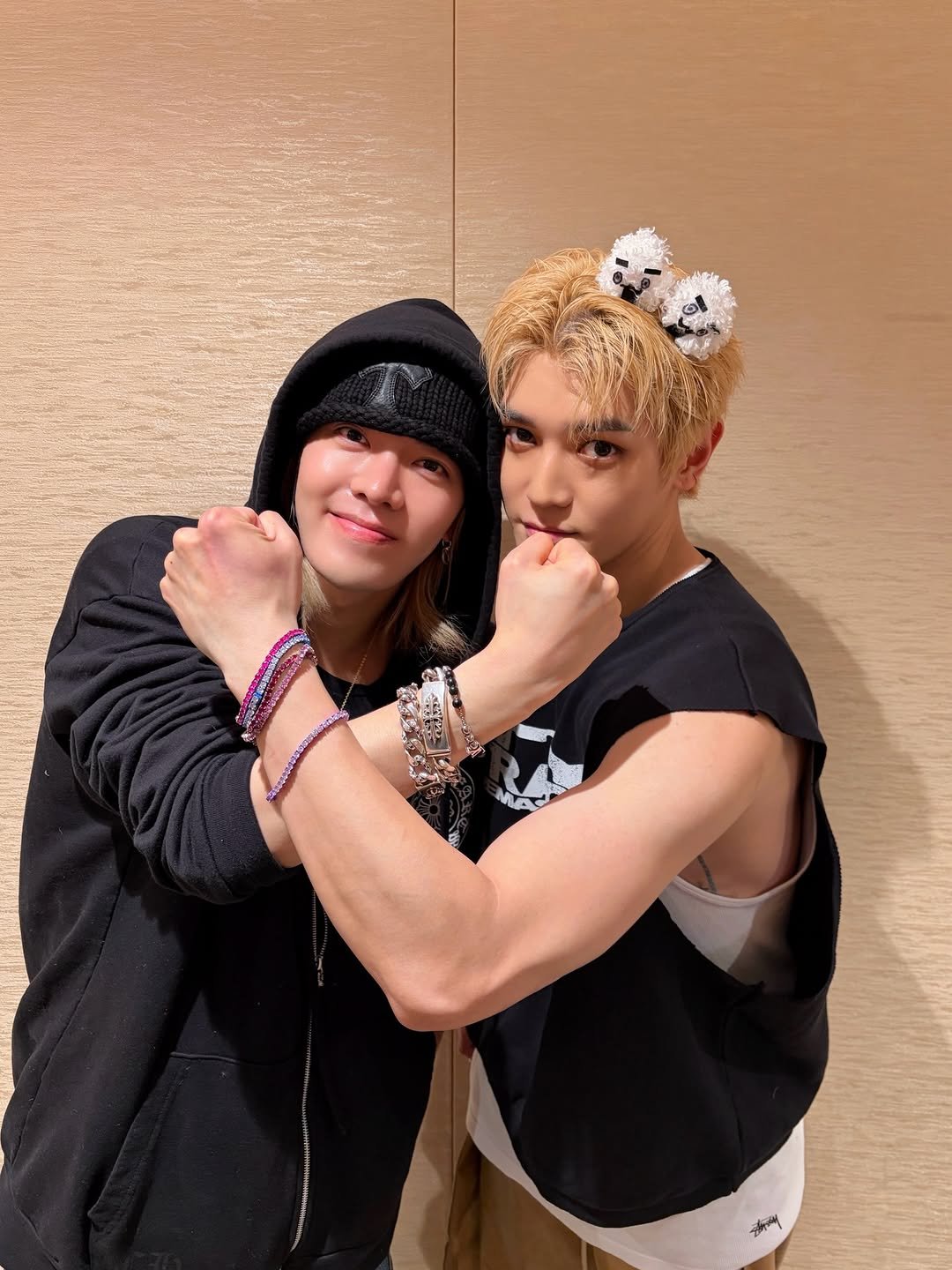 Photo shared by NCT Official Instagram on February 17, 2026 tagging @yuu_taa_1026, and @taeoxo_nct. May be an image of one or more people, bangs, biceps and text.