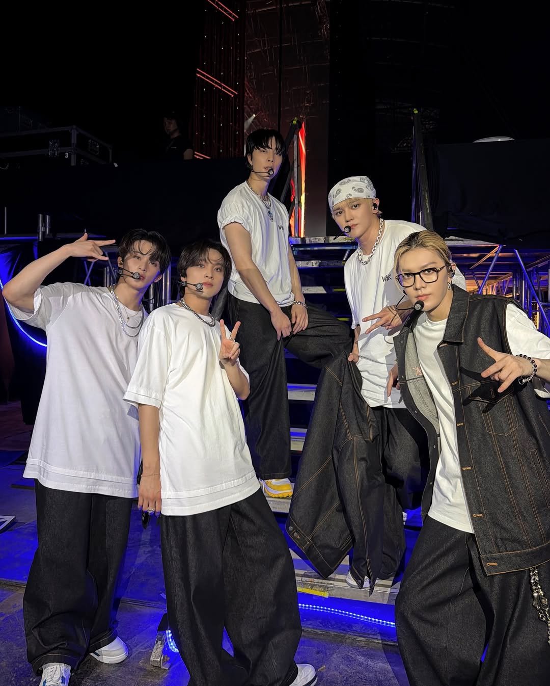 Photo shared by NCT 127 Official Instagram on February 14, 2026 tagging @smtown, and @nct. May be an image of one or more people, bangs, bandanna, costume and text.