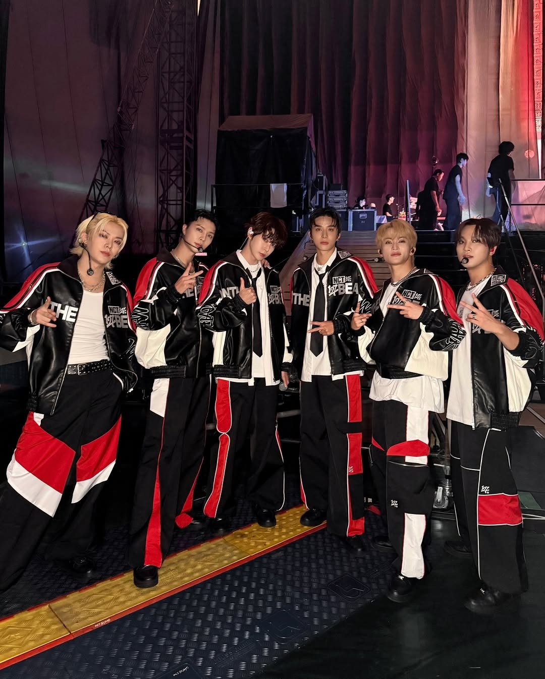 Photo shared by NCT 127 Official Instagram on August 09, 2025 tagging @smtown, and @nct. May be an image of 9 people, costume, concert and text that says 'HE MC 供 THE ACTE 眠 蝶'.