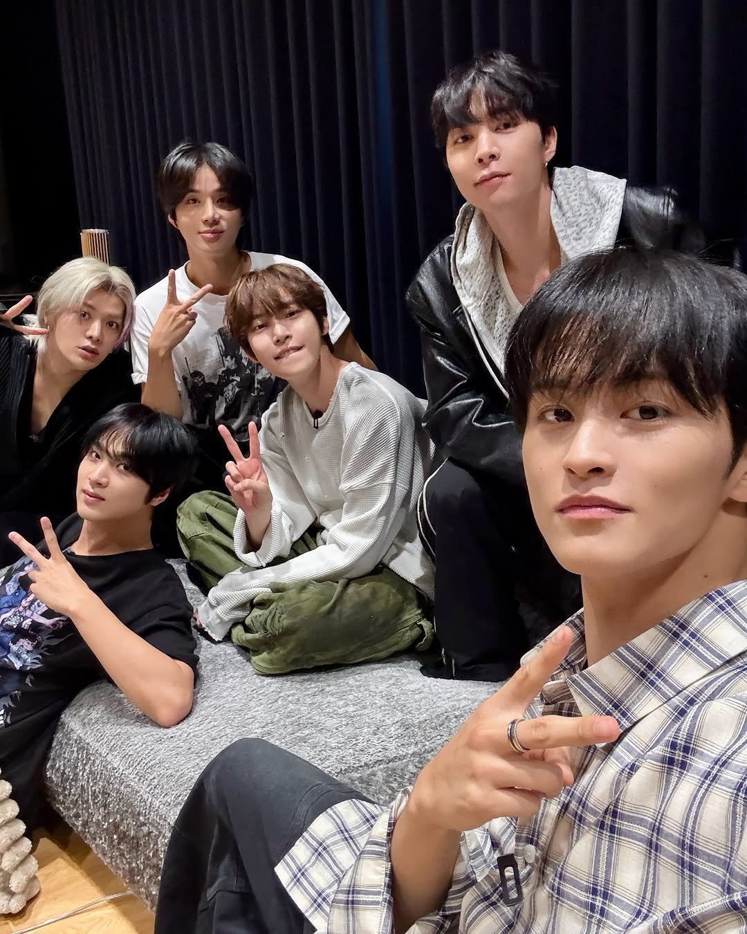 Photo shared by NCT 127 Official Instagram on October 27, 2025 tagging @yuu_taa_1026, @johnnyjsuh, @do0_nct, @onyourm__ark, @haechanahceah, and @sugaringcandy. May be an image of text that says 'V'.