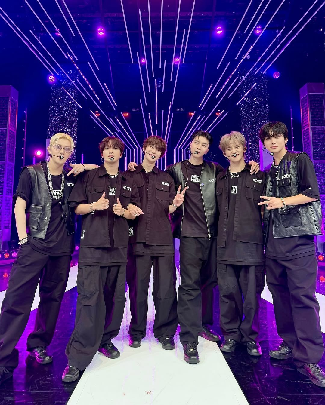 Photo shared by NCT 127 Official Instagram on September 15, 2025 tagging @yuu_taa_1026, @johnnyjsuh, @do0_nct, @onyourm__ark, @haechanahceah, and @sugaringcandy. May be an image of 6 people and text.