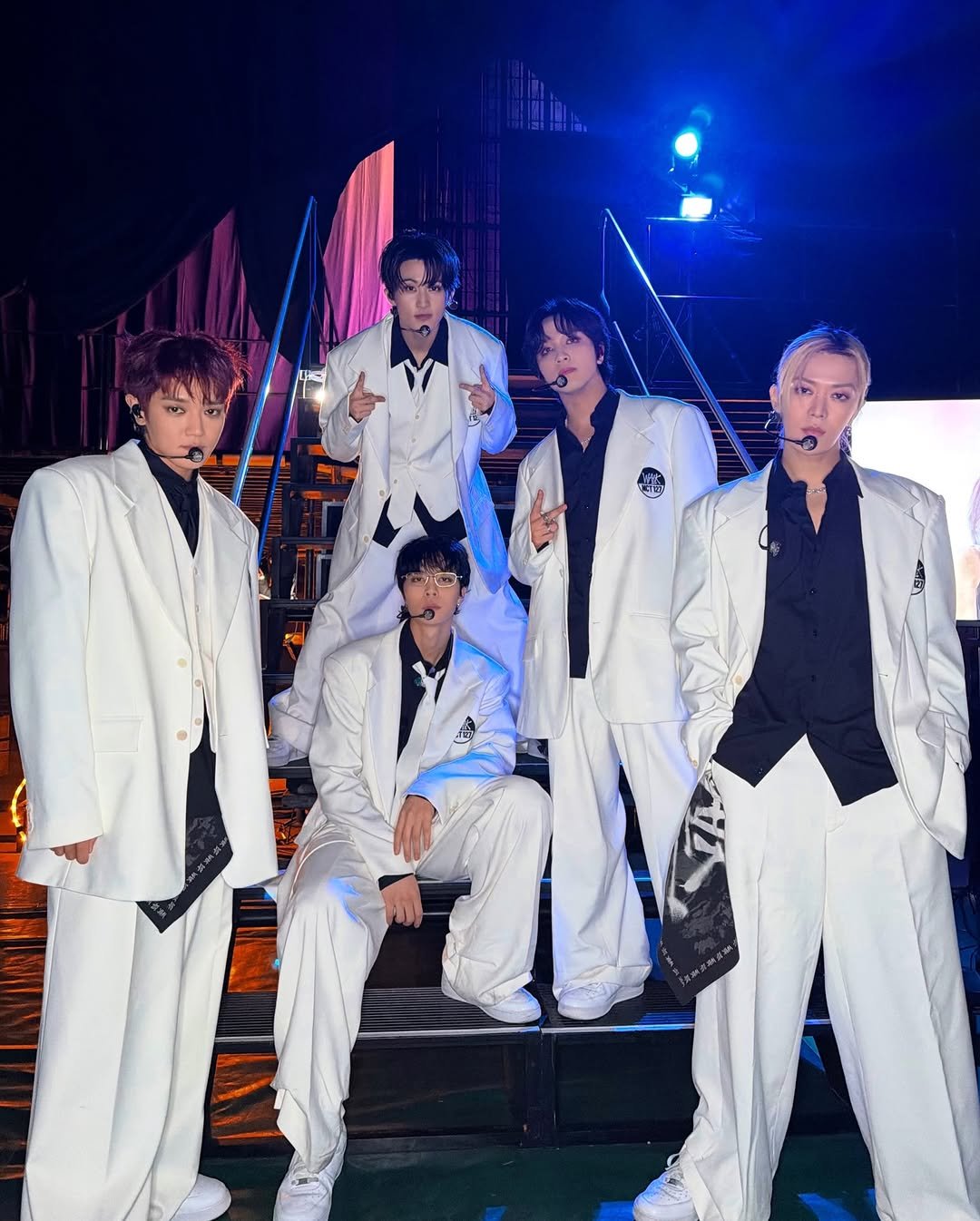 Photo shared by NCT 127 Official Instagram on February 01, 2026 tagging @smtown, and @nct. May be an image of one or more people, bangs, top, concert and text.