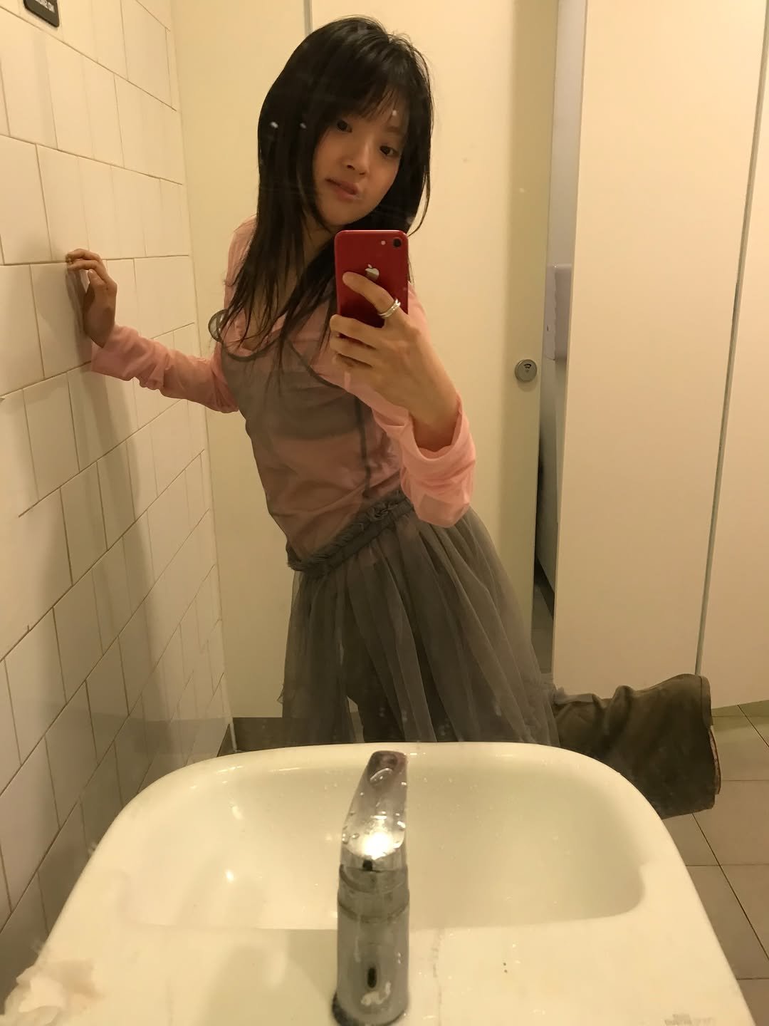 Photo shared by 목지혜 on February 18, 2026 tagging @openyy_official. May be a selfie of mirror, miniskirt and text.
