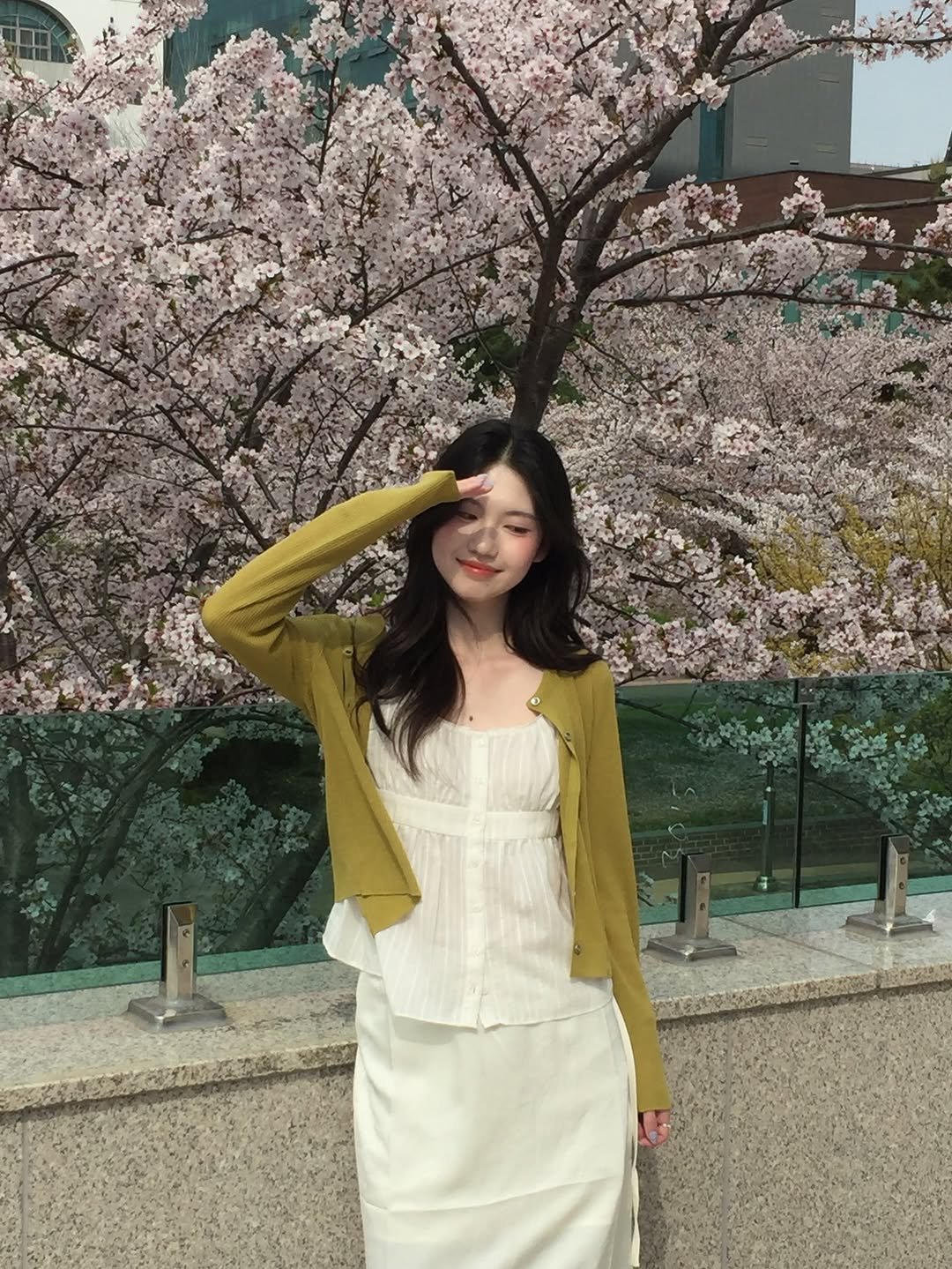 Photo by 여진 on April 20, 2026. May be an image of blazer, white lily, stone-fruit tree and text.