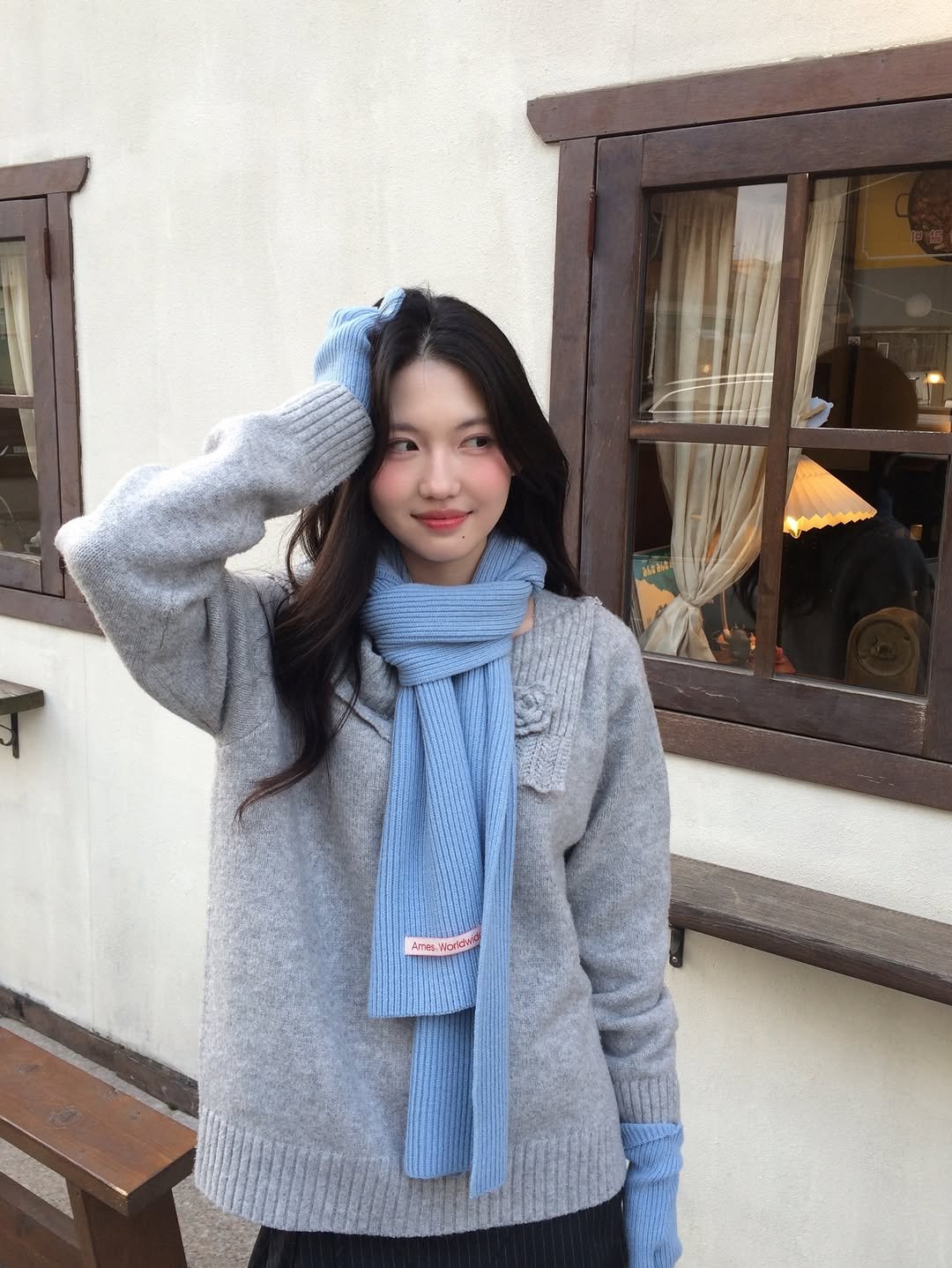 Photo shared by 여진 on January 15, 2026 tagging @ames_worldwide. May be an image of scarf, cardigan, parka, shawl and text.
