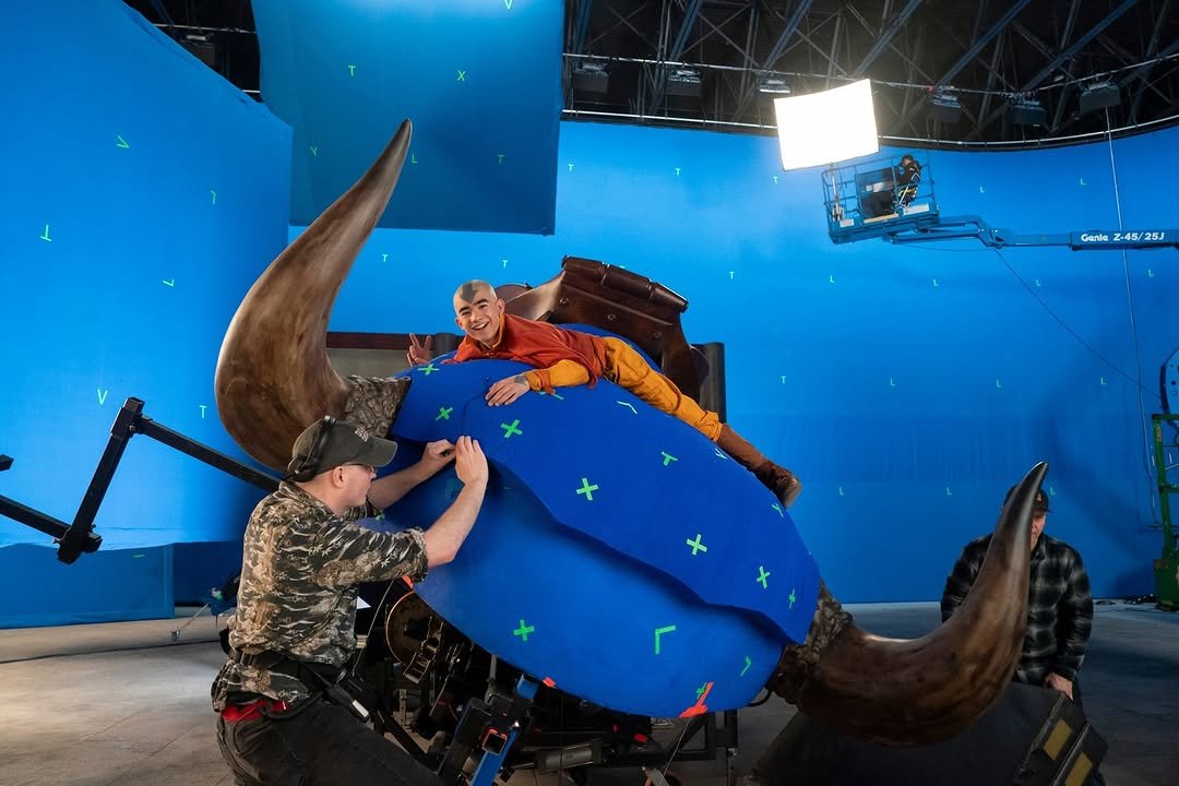 Photo shared by Netflix US on February 22, 2026 tagging @avatarnetflix. May be an image of people kissing, rhinoceros, costume and text.