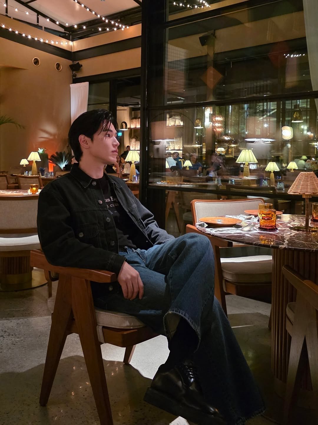 Photo shared by New Thitipoom on April 02, 2026 tagging @americaneagleth. May be an image of duffle coat, overcoat and text.