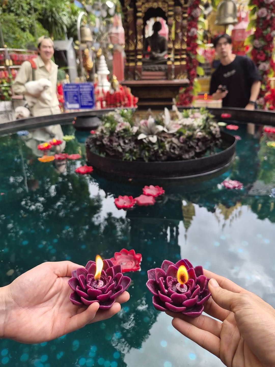 Photo shared by Tawan Vihokratana on November 06, 2025 tagging @newwiee. May be an image of candle, temple and text.