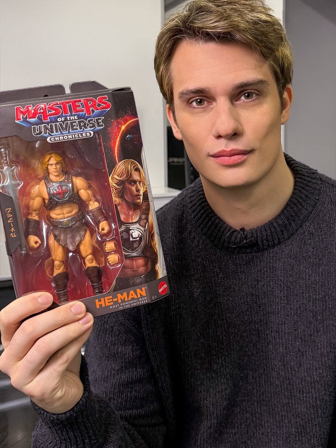 Photo by Nicholas Galitzine on January 29, 2026. May be an image of vulture, toy, Superman, magazine and text.