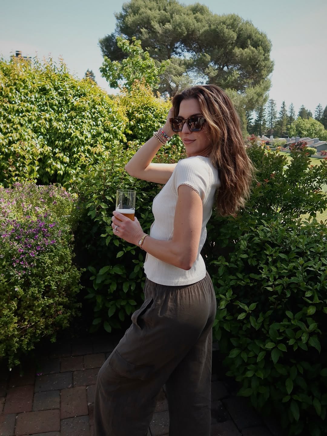 Photo shared by Nichole Ciotti on April 20, 2026 tagging @freepeople, @oldnavy, and @ryansimkhaieyeshop. May be an image of wine glass, outdoors and text.