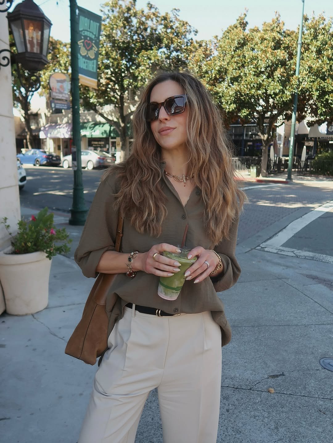 Photo shared by Nichole Ciotti on August 16, 2025 tagging @dannijo, @ghd_northamerica, and @jasmincolorist. May be an image of 1 person, outerwear, sunglasses and text.