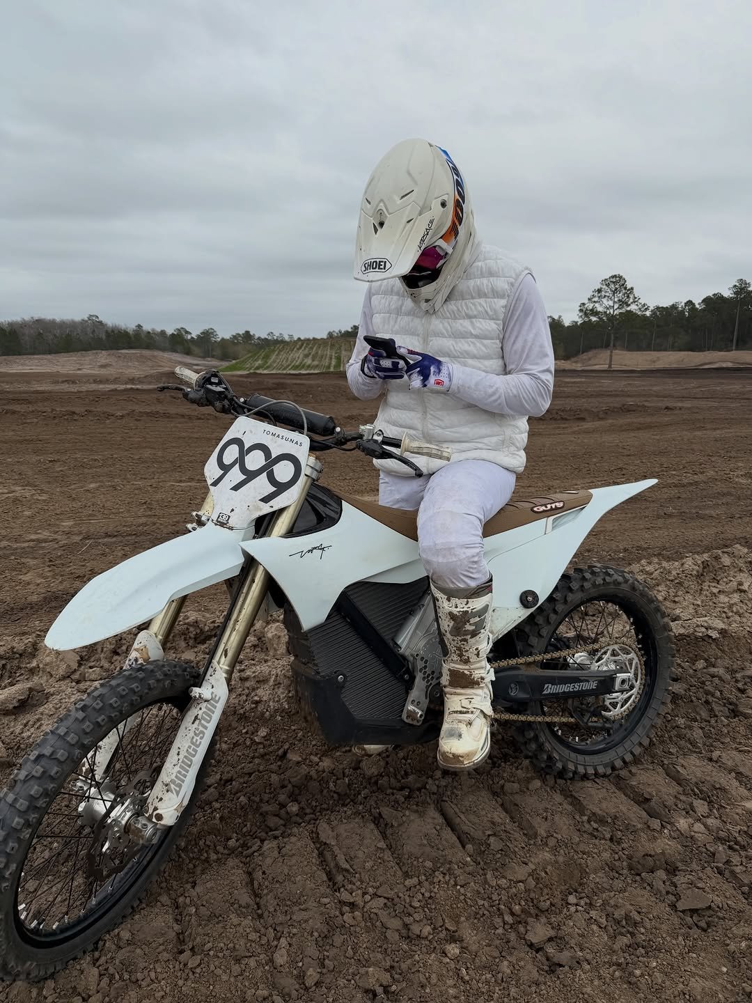Photo by Nick Tomasunas on February 07, 2026. May be an image of racing vehicles, dirt bike, motorcycle, face mask, helmet, glasses and text.